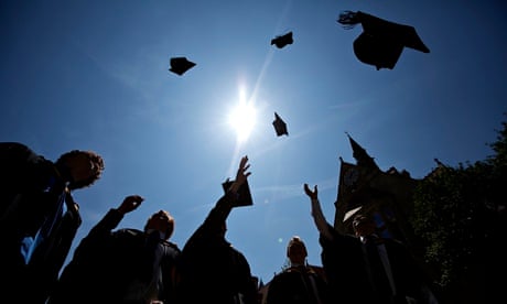 Graduates celebrate throwing hats into the air
