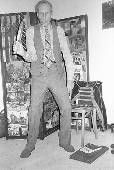 Portrait of American author William S. Burroughs as he sits and wears Portrait of American author William S. Burroughs as he sits and wears