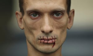 Pyotr Pavlensky with sewn up mouth