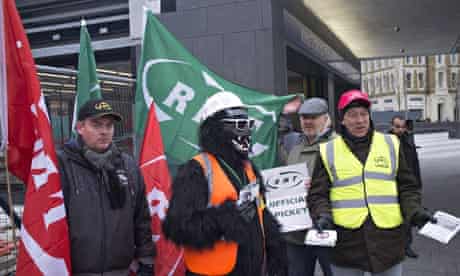 Striking tube workers on a picket line at King's Cross underground station