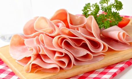 Thinly sliced ham on a chopping board