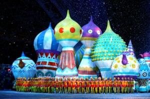 Giant hot air balloons with the Russian architecture style onion dome provide a backdrop for dancers.