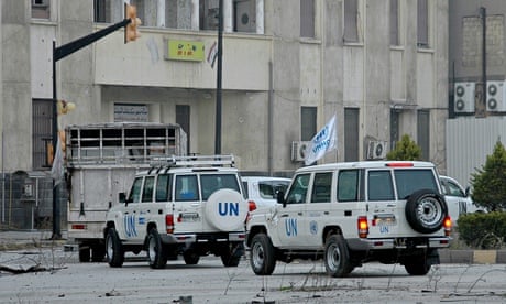 convoy of United Nations and Syrian Red Crescent vehicles entering the regime-held areas of Homs