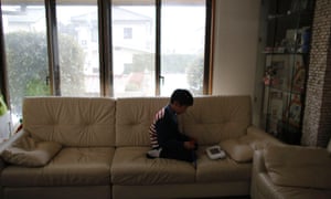 Seven-year-old Masyoshi Kaneta plays Nintendo Wii U game in his home in Koriyama, west of the tsunami-crippled Fukushima Daiichi nuclear power plant.
