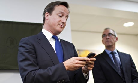 David Cameron using a mobile phone