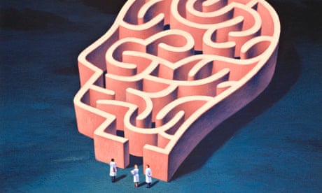 Scientists at the entrance to a head-shaped maze