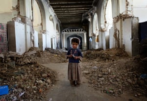 An Afghan girl stands in the ruins of Darul Aman Palace on October 21, 2010 on the outskirts of Kabul, Afghanistan. A group of Afghan Kuchi tribal nomads settled into the palace several months before under the protection of Afghan paramilitary police that use the ruins as a makeshift patrol base, after being driven from a nearby area in Kabul during a bout of ethnic riots earlier in the summer.