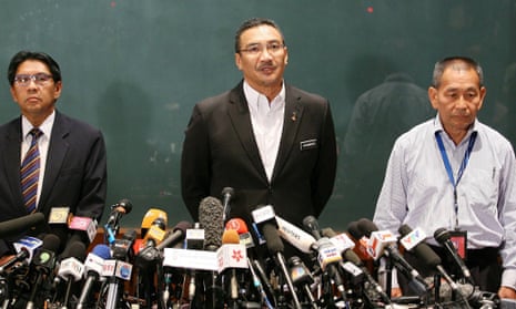 Malaysia's Minister of Defence and acting Transport Minister Datuk Seri Hishammuddin Hussein (centre) with Department of Civil Aviation director general Azharuddin Abdul Rahman (left) and Malaysian Airlines Group Chief Executive Ahmad Jauhari Yahyain (right) speak about the missing Malaysian Airlines plane during a press conference.