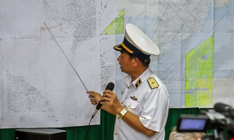 Vietnamese Navy's Deputy Commander Rear Admiral Le Minh Thanh (R) points at a map to show the area where Vietnam is conducting search activities for the missing Malaysia Airlines flight 370 in Phu Quoc island on March 12, 2014. Vietnam said on March 12 it had suspended its air search for missing flight MH370 and scaled back a sea search as it waited for Malaysia to clarify the potential new direction of the multi-national hunt.        AFP PHOTO / LE QUANG NHATLE QUANG NHAT/AFP/Getty Images