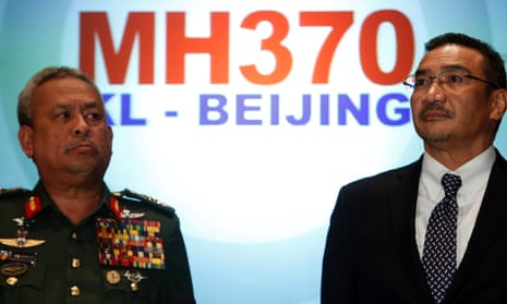 Malaysia's acting Transport Minister Hishammuddin Hussein listens to questions next to Chief of Armed Forces General Zulkifeli Mohd.