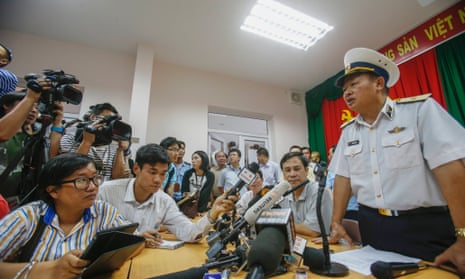 Admiral Le Minh Thanh, Deputy Commander of Vietnamese Navy speaks about their mission to find the missing Malaysia Airlines flight MH370 during a news conference at Phu Quoc Airport in Phu Quoc Island.  Vietnam briefly scaled down search operations in waters off its southern coast, saying it was receiving scanty and confusing information from Malaysia over where the aircraft may have headed after it lost contact with air traffic control.