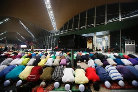 Muslim men offer prayers at the Kuala Lumpur International Airport for the missing Malaysia Airlines jetliner MH370, Thursday, March 13, 2014, in Sepang, Malaysia.