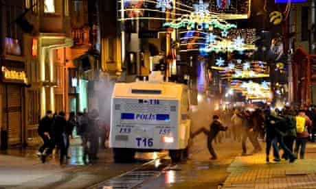 Protesters attack a Turkish police van following the funeral of a teenager