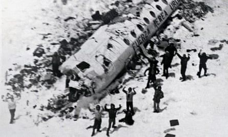 Survivors of the plane crash in the Chilean Andes wave to the rescue helicopter