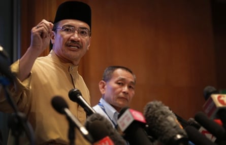 Malaysia's Minister of Transport Hishamuddin Hussein, left and Malaysia Airlines Group CEO Ahmad Jauhari Yahya, right, answers queries from the media during a press conference regarding missing Malaysia Airlines jetliner MH370 in Sepang, Malaysia.