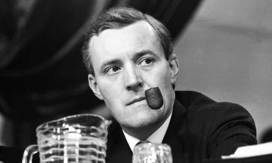 Tony Benn puffs on his pipe as he listens to speeches during the second day of the 66th annual Labour Party Conference, in Scarborough, England.