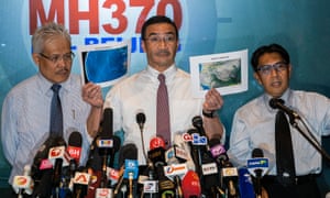Malaysian acting transport minister Hishamuddin Hussein shows north corridor and south corridor maps with deputy minister of foreign affairs, Hamzah Zainudin and Malaysia's department civil aviation director general, Azharuddin Abdul Rahman during a media conference at Kuala Lumpur International Airport.