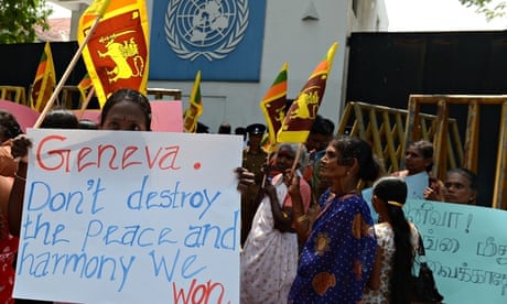 Tamil pro-government activist hold a placard outside the UN offices in Colombo
