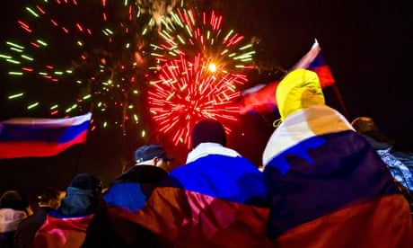 People in Russian flags celebrate Crimea referendum results