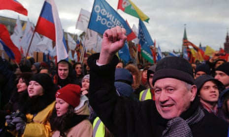 People attend a rally called "We are together" to support the annexation of Ukraine's Crimea to Russia at Red Square in central Moscow, 18 March, 2014.