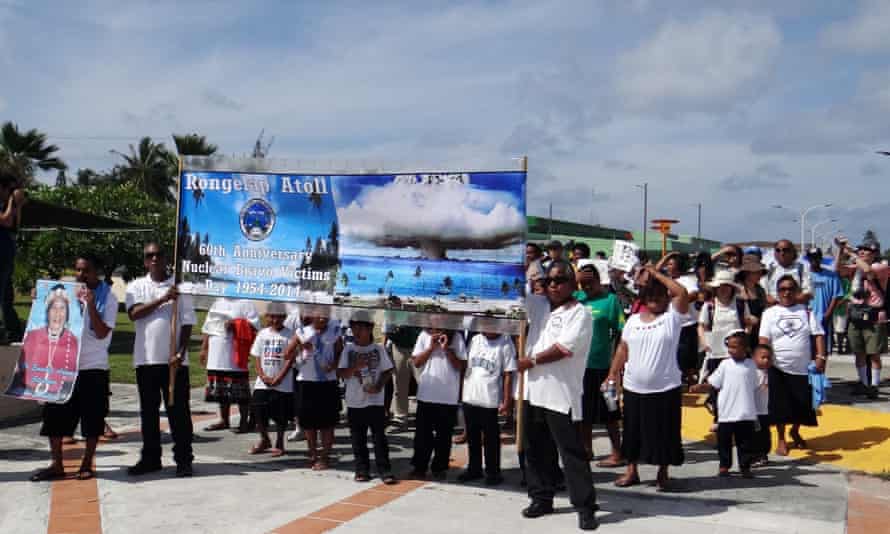 Islanders and descendants from Rongelap Atoll march in Majuro on the 60th anniversary of the nuclear explosion that led to their exile.