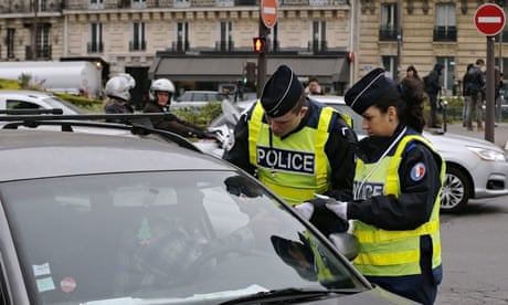 Paris car ban: police officers check a vehicle