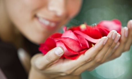 Woman smelling rose flowers