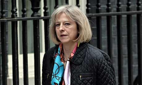 Theresa May walking into Downing Street