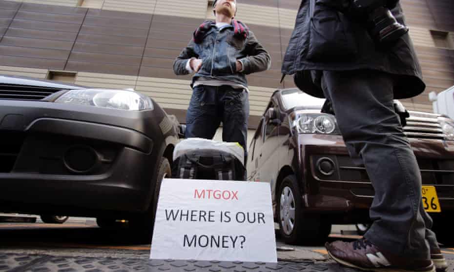 Bitcoin trader Kolin Burges stands in protest outside an office building housing Mt. Gox in Tokyo.