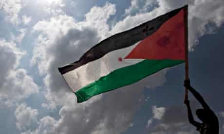 The Palestinian flag being waved during a demonstration in the West Bank village of Bilin