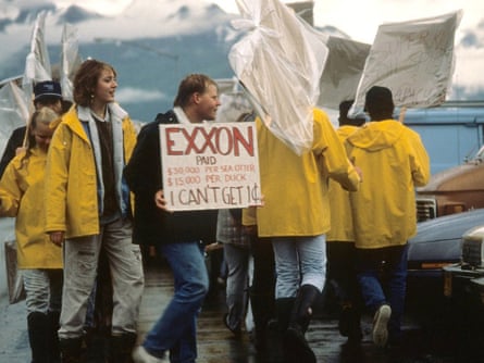 Valdez based seafood processors picket Exxon's Headquarters protesting a shortage of work due to the Exxon Valdez oil spill (wide shot) , Valdez, 24 July 1989.