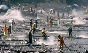 Exxon Valdez oil spill workers use pressure washers to wash oil from the beach at Smith Island on Alaska's Prince William Sound.