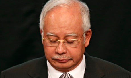 Malaysian prime minister Najib Razak announces that MH370 ended its journey in the Indian Ocean