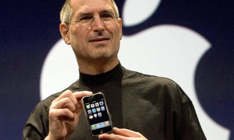 Steve Jobs holding the original iPhone at its introduction in January 2007: he had threatened to fire the engineers working on the original project.