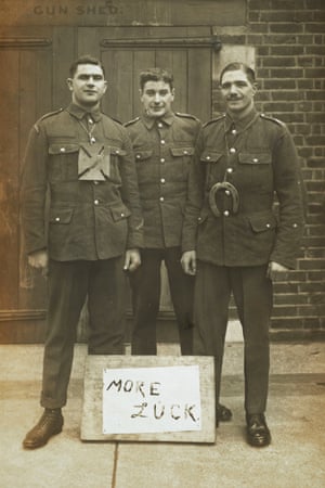 Three soldiers sign 'More Luck'