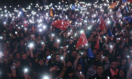 Supporters of Turkey's ruling AK party cheer after the election results, in Ankara.