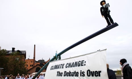 Climate change: the debate is over reads activists banner outside IPCC meeting in Stockholm, Sweden