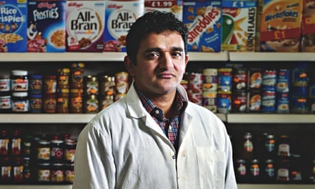 Wahid Ahmad in the shop where he stacks shelves in north London