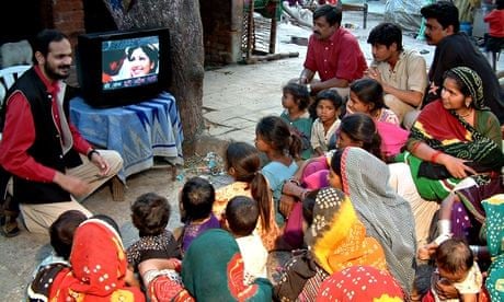 Social entrepreneurship in action: Brij Kothari demonstrating SLS to viewers in Gulbai Tekra Slum, A