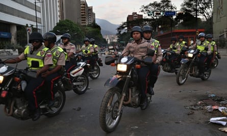 Venezuelan security forces chase anti-government protesters in Caracas