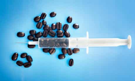 Syringe filled with coffee beans