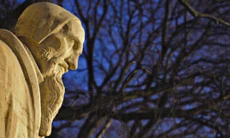 A statue of John Calvin at Geneva's Reformation wall. 
