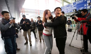 Relatives of passengers at Beijing airport.