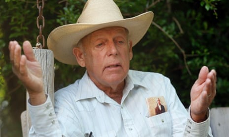 Rancher Cliven Bundy gestures at his home in Bunkerville, Nevada.