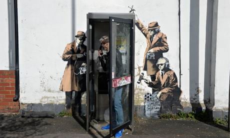 Possible Banksy work near GCHQ shows agents tapping into phone box