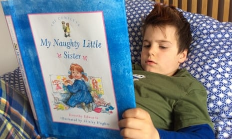 boy reads  My Naughty Little Sister book