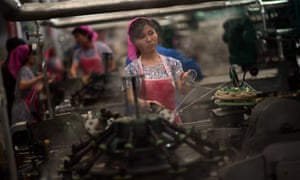 North Korean employees work in a textile factory in Pyongyang.