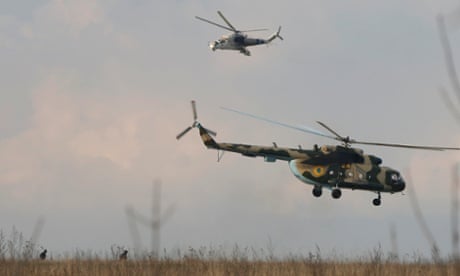 Ukrainian helicopters take off after delivering troops to an airbase in Kramatorsk, in eastern Ukraine April 15, 2014. 