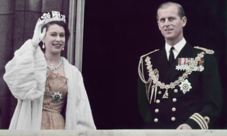 1953: Queen Elizabeth II waving from the balcony at Buckingham Palace with her husband Prince Philip Duke of Edinburgh.