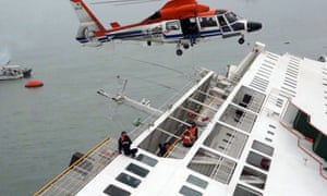 South Korea Coast Guard members in helicopters trying to rescue some of the 477 passengers and crew aboard a South Korean ferry that capsized on its way to Jeju island from Incheon. South Korean officials said as many as 295 people were still unaccounted for after a ferry carrying 477 passengers and crew capsized off the south coast.